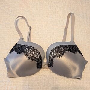 Victoria's Secret Push-Up bra. Size 32C. Gray with black lace detail.